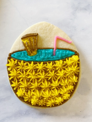 decorated pineapple cookies with buttercream