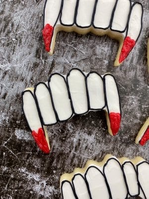 vampire fang cookies with buttercream frosting