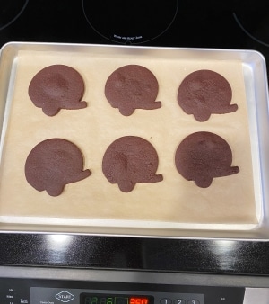 baked chocolate cut out cookies that have small bubbles