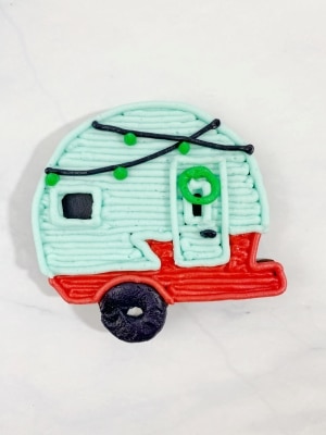 Draw a circle on the camper door and small dots for the Christmas lights