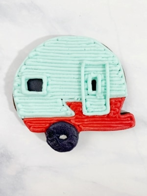 Add the tire to the Christmas camper cookie.