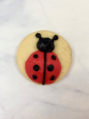 ladybug cookie with buttercream