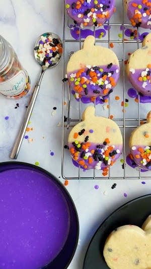 Halloween sprinkle sugar cookie recipe dipped in buttercream glaze