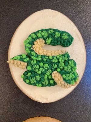 snake sugar cookies with buttercream scales created with a piping tip