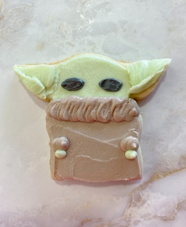 baby yoda sugar cookies with piped eyes