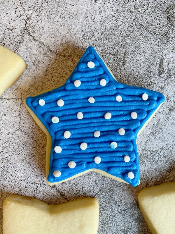 blue star cookie with buttercream frosting
