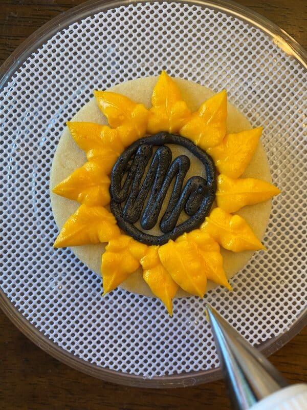 adding second layer of petals for the buttercream sunflowers