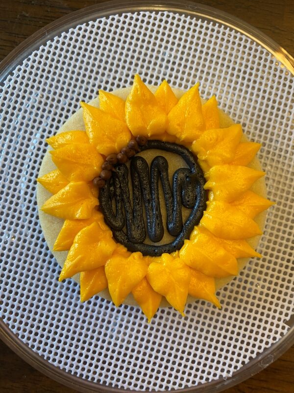 piped brown buttercream sunflower seeds