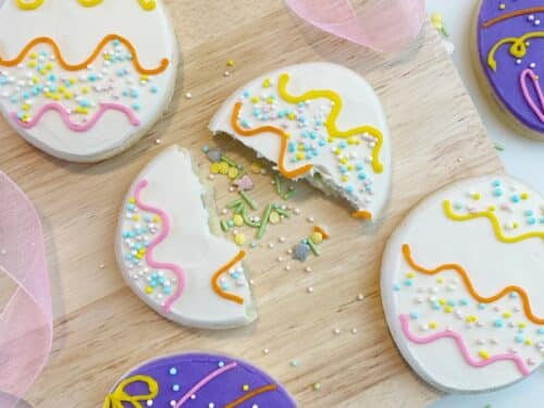 Sprinkle filled Easter egg cookies with buttercream frosting and Foliay sprinkles