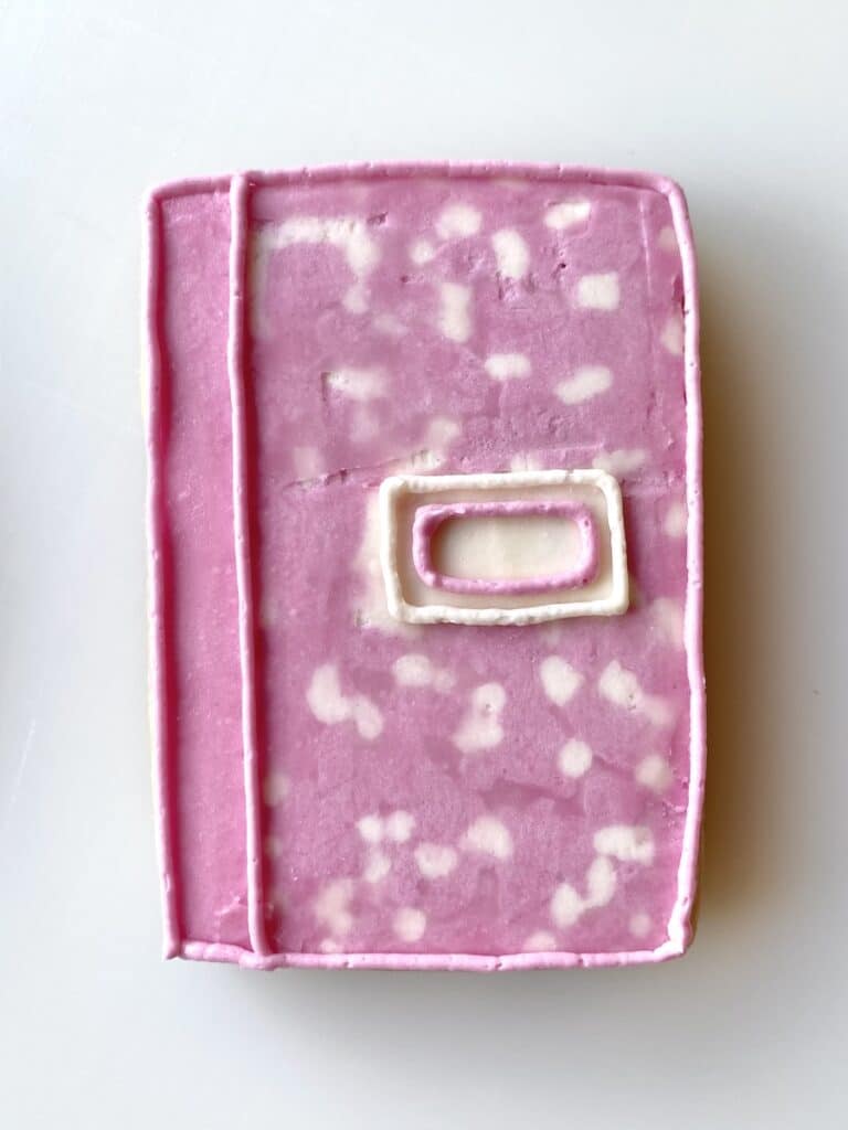 composition notebook cookie with buttercream